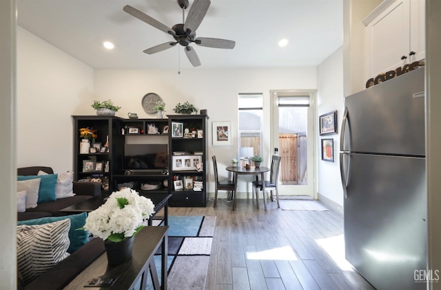 9108 Manor Forest Ln, Shafter, CA 93263 - living area featuring wood finished floors, a ceiling fan, and recessed lighting