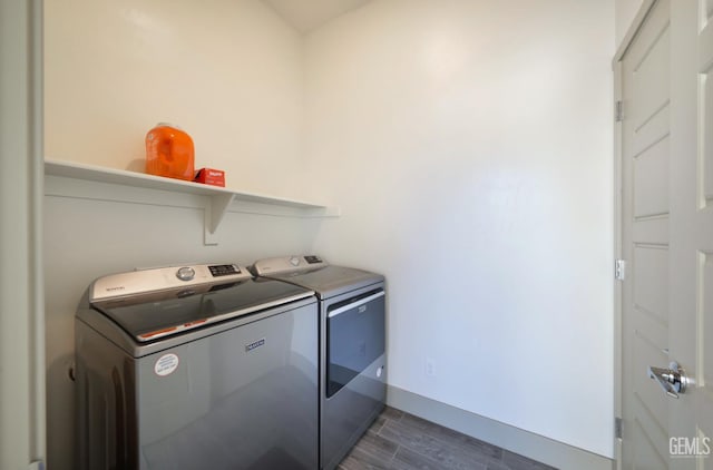 9108 Manor Forest Ln, Shafter, CA 93263 - laundry room with washer and dryer and wood tiled floors