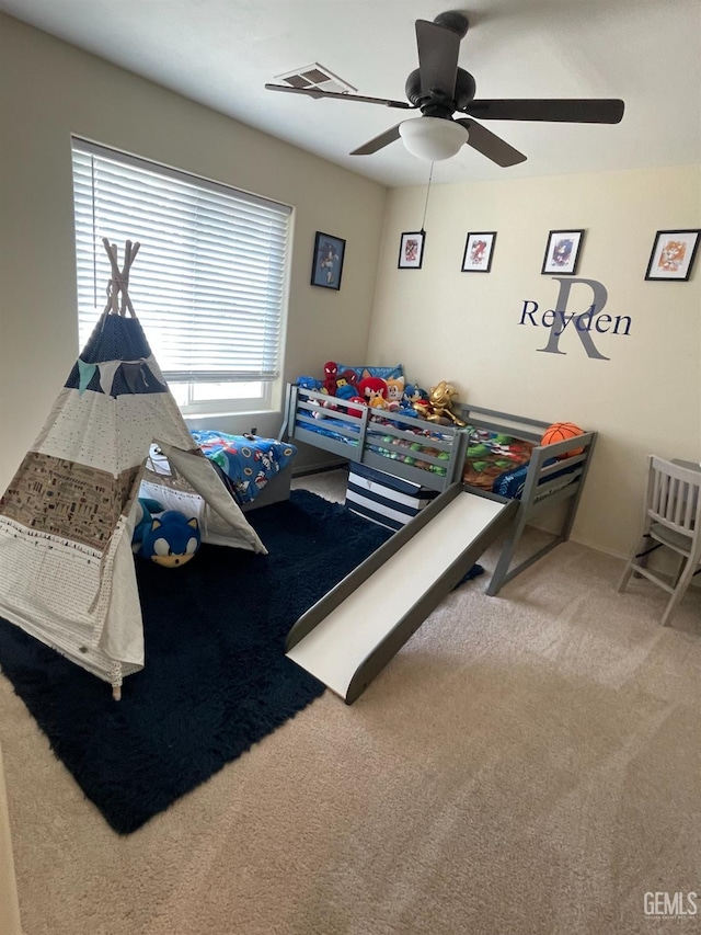 bedroom with ceiling fan and carpet