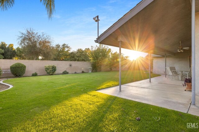 14013 Laverton Ave, Bakersfield, CA 93314 - view of yard featuring a ceiling fan and a patio area