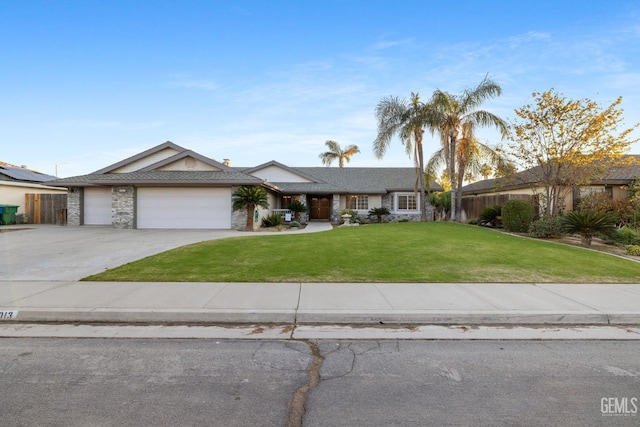 14013 Laverton Ave, Bakersfield, CA 93314 - ranch-style house featuring a garage, concrete driveway, and stone siding