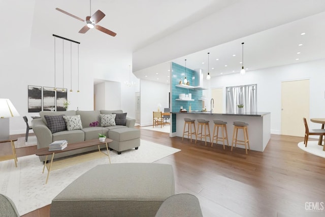 14013 Laverton Ave, Bakersfield, CA 93314 - living area featuring wood finished floors, a ceiling fan, recessed lighting, and a towering ceiling