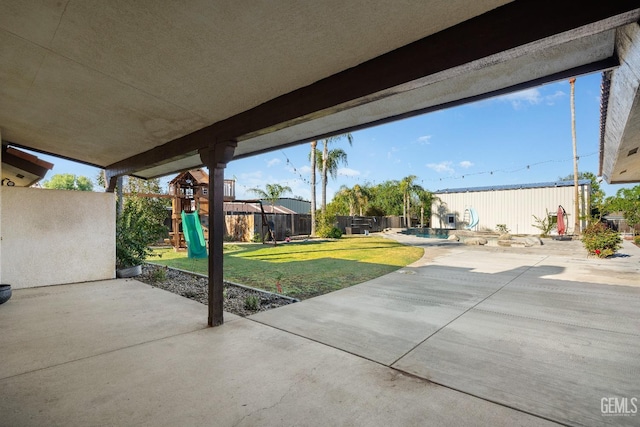 view of patio featuring a playground