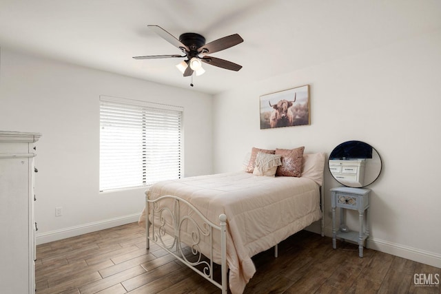 bedroom featuring dark wood-type flooring and ceiling fan