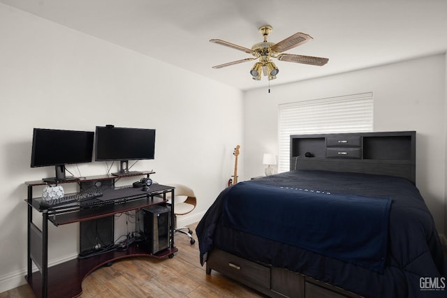 bedroom with hardwood / wood-style flooring and ceiling fan