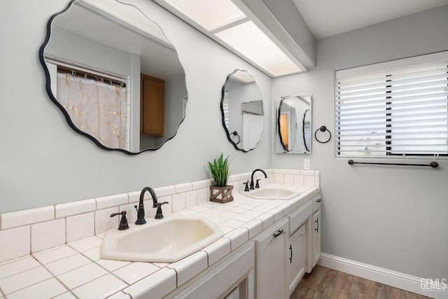 bathroom with vanity and hardwood / wood-style floors