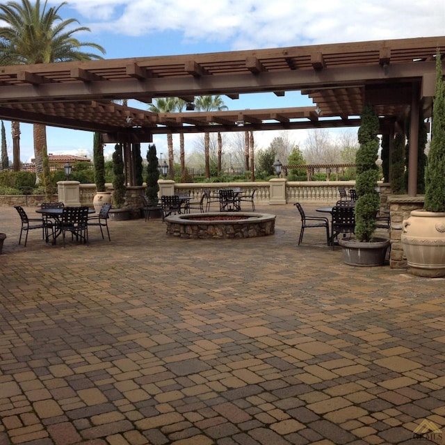 view of community with a pergola and a patio