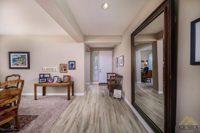 hall with light hardwood / wood-style flooring