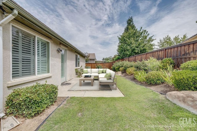 view of yard with outdoor lounge area and a patio