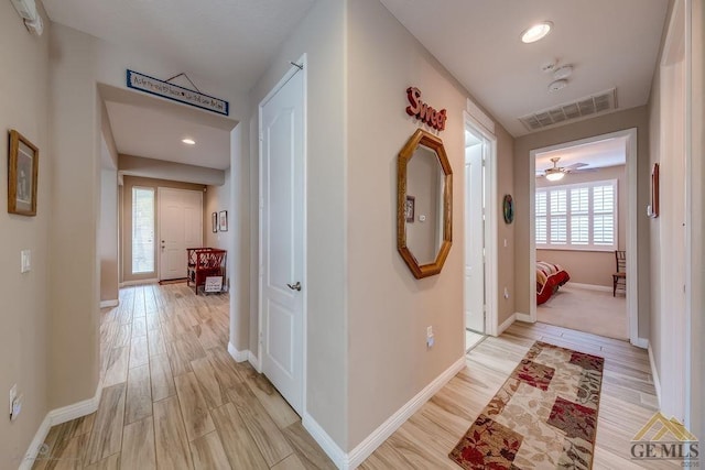 corridor featuring light hardwood / wood-style floors