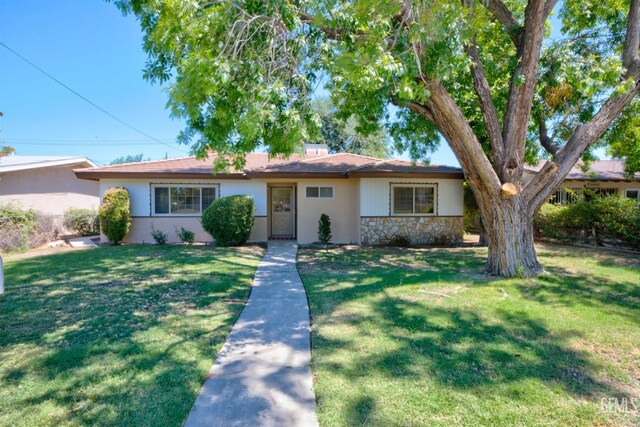 3504 Planz Rd, Bakersfield, CA 93309 - single story home featuring a front lawn, stone siding, and stucco siding