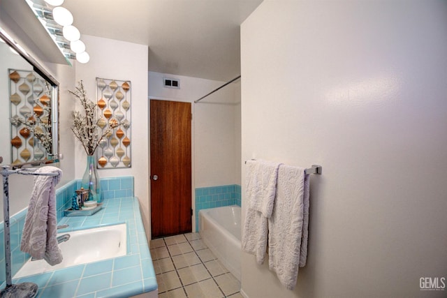 3504 Planz Rd, Bakersfield, CA 93309 - bathroom featuring a tub, tile patterned flooring, and vanity