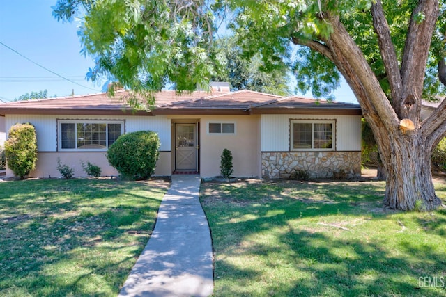 3504 Planz Rd, Bakersfield, CA 93309 - single story home featuring a front lawn and stone siding