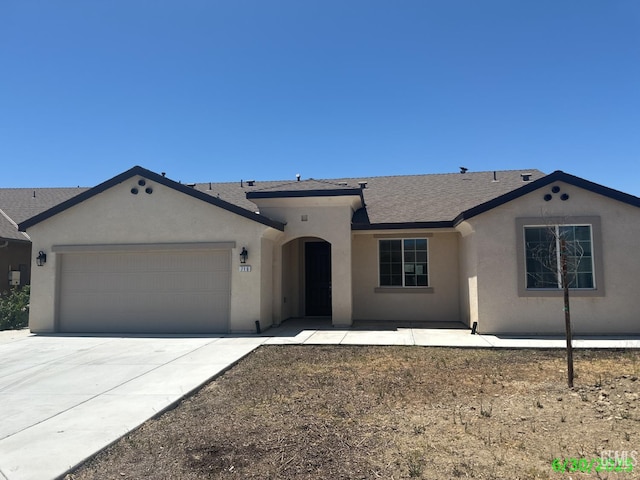716 Montejo Ct, Delano, CA 93215 - single story home featuring stucco siding, an attached garage, concrete driveway, and a shingled roof