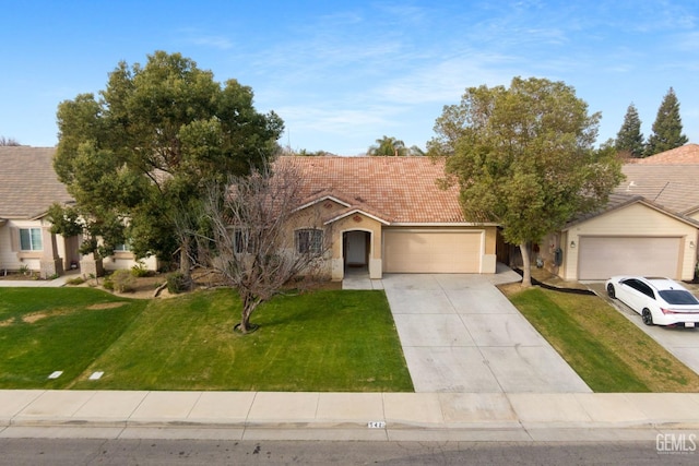 ranch-style home with a garage and a front lawn