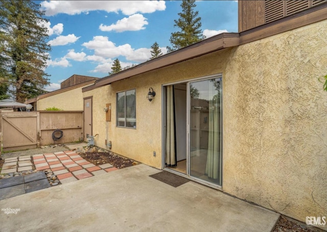 view of patio / terrace featuring a gate and fence