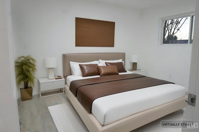 bedroom featuring wood finished floors