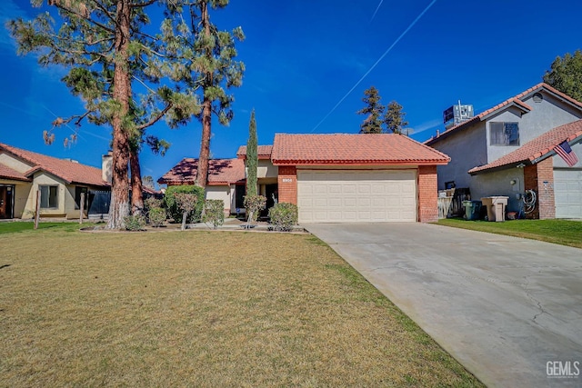 view of front of house with an attached garage, brick siding, a tiled roof, driveway, and a front yard