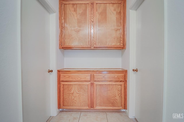 interior space featuring light countertops and light tile patterned flooring