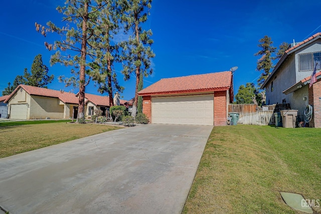 view of front of property featuring a tile roof, a front yard, concrete driveway, and brick siding