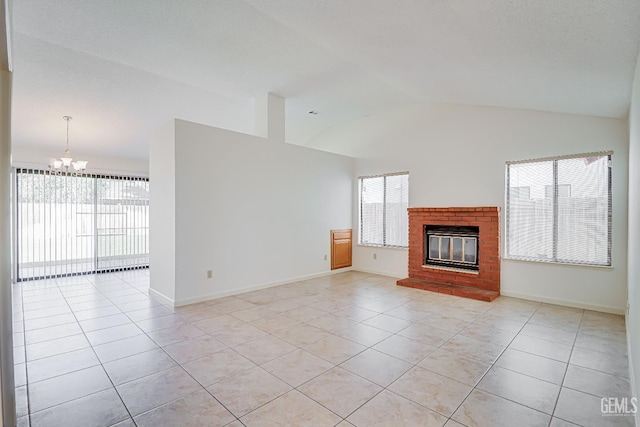 unfurnished living room with a brick fireplace, plenty of natural light, and light tile patterned floors