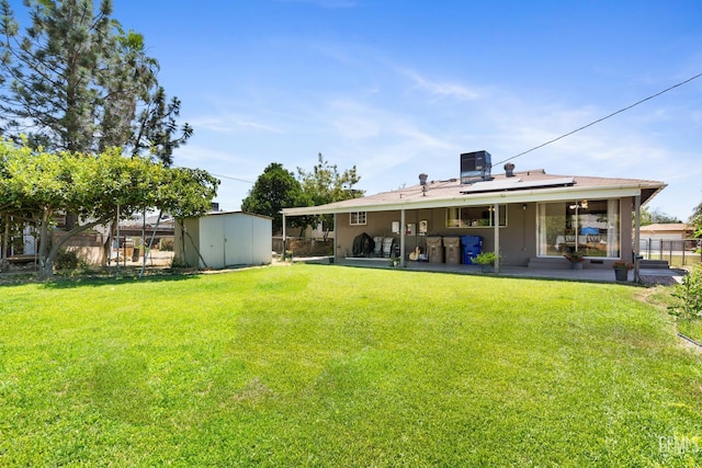 10801 Santa Clara St, Lamont, CA 93241 - rear view of property featuring a patio and solar panels
