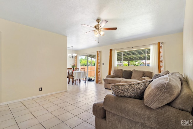 10801 Santa Clara St, Lamont, CA 93241 - living room featuring a ceiling fan, a chandelier, light tile patterned floors, baseboards, and a textured ceiling