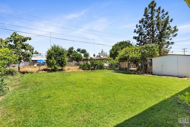 10801 Santa Clara St, Lamont, CA 93241 - view of yard with an outbuilding