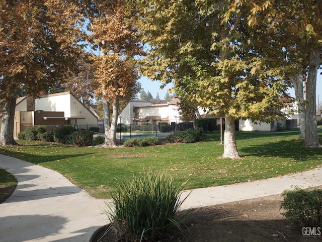 view of home's community with a lawn