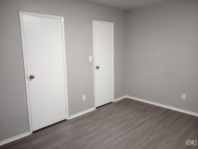 unfurnished bedroom with wood-type flooring