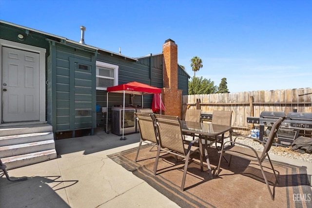 view of patio with a grill