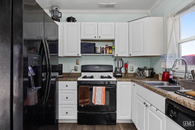 kitchen with white cabinetry, black appliances, and ornamental molding