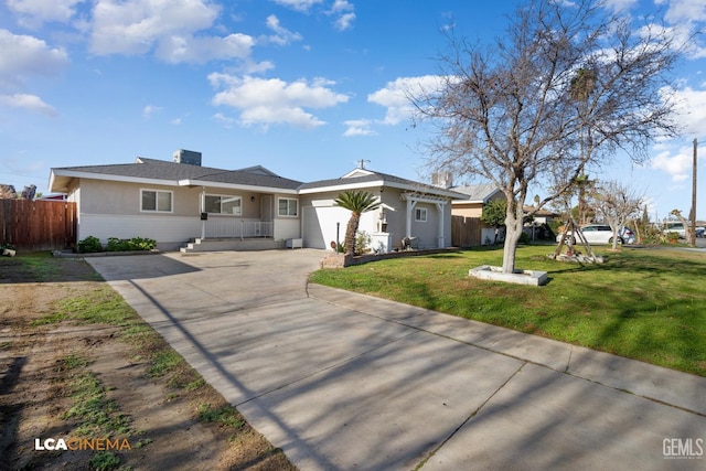 ranch-style home with a front lawn