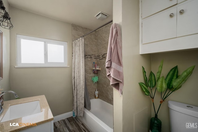 full bathroom with shower / bathtub combination with curtain, vanity, wood-type flooring, and toilet