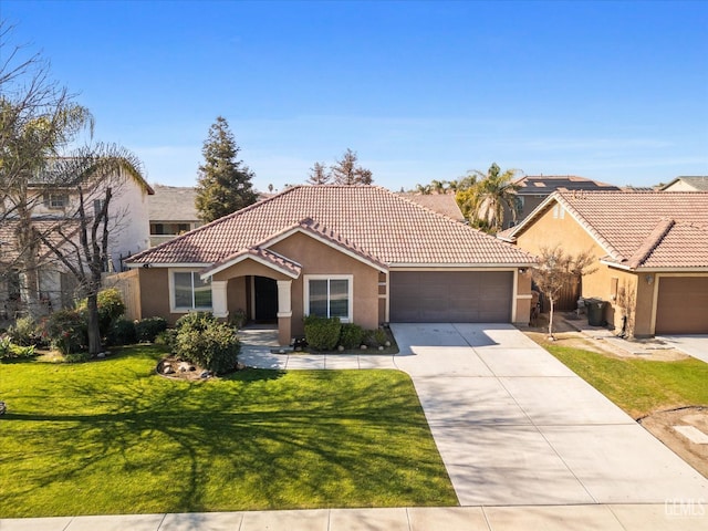 view of front of home featuring a garage and a front lawn