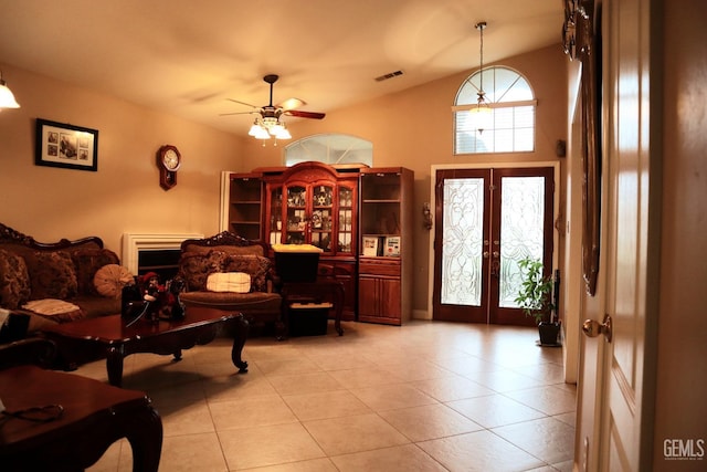 sitting room with light tile patterned floors, french doors, and ceiling fan