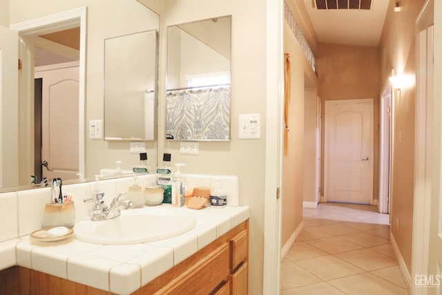 bathroom featuring tile patterned floors and vanity