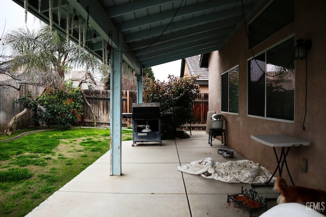 view of patio featuring a grill