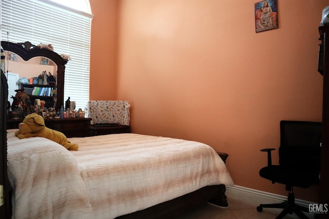 bedroom with tile patterned floors