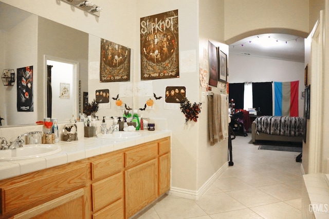 bathroom with tile patterned flooring and vanity