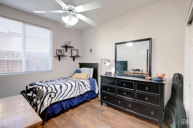 bedroom featuring hardwood / wood-style flooring and ceiling fan