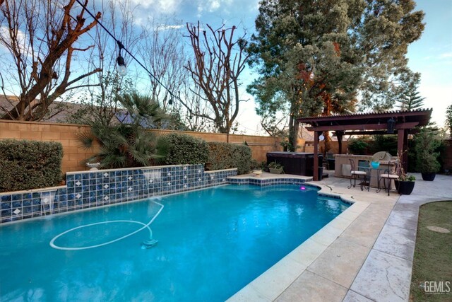 view of pool with a pergola, a patio area, a hot tub, and an outdoor bar