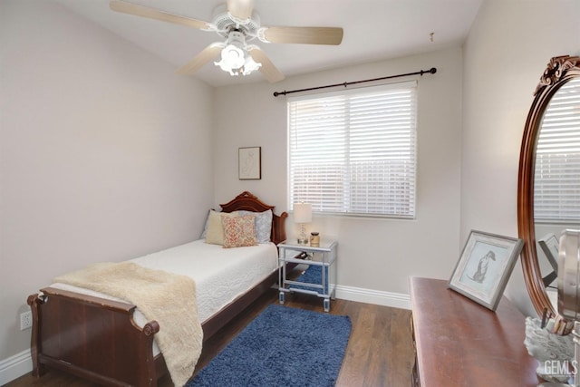 bedroom with dark wood-type flooring and ceiling fan