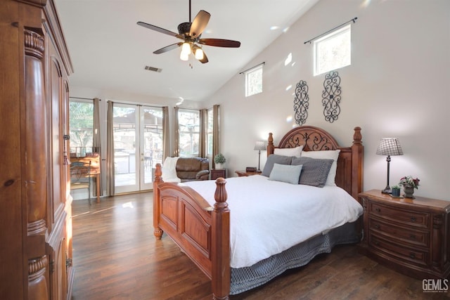 bedroom featuring french doors, dark hardwood / wood-style flooring, multiple windows, and access to outside