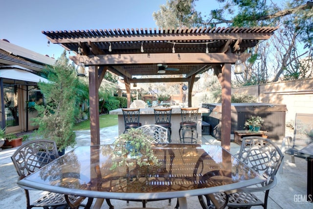 view of patio / terrace featuring a pergola, ceiling fan, and a bar