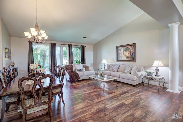 dining area with ornate columns, dark hardwood / wood-style floors, a notable chandelier, and high vaulted ceiling