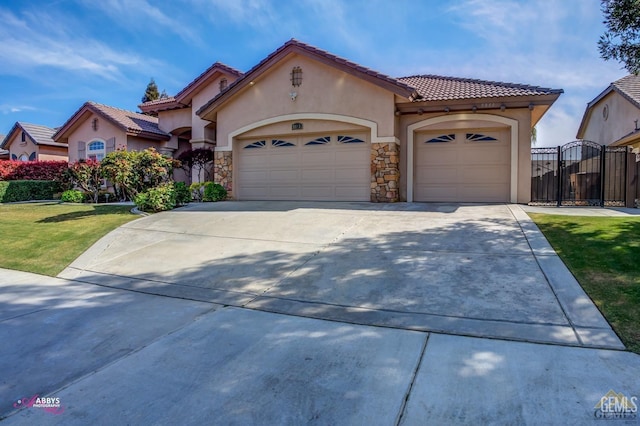 mediterranean / spanish-style home with a front yard and a garage