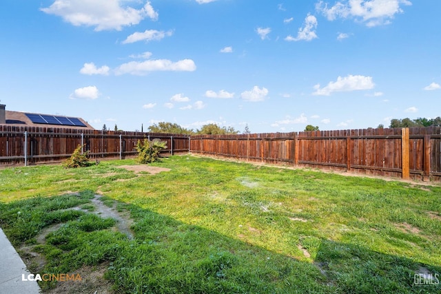 view of yard featuring a fenced backyard