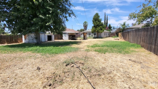 2132 Wingland Dr, Bakersfield, CA 93308 - fenced backyard with a storage unit