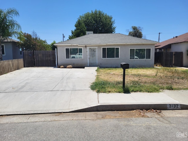 2132 Wingland Dr, Bakersfield, CA 93308 - view of front of house featuring stucco siding and a shingled roof